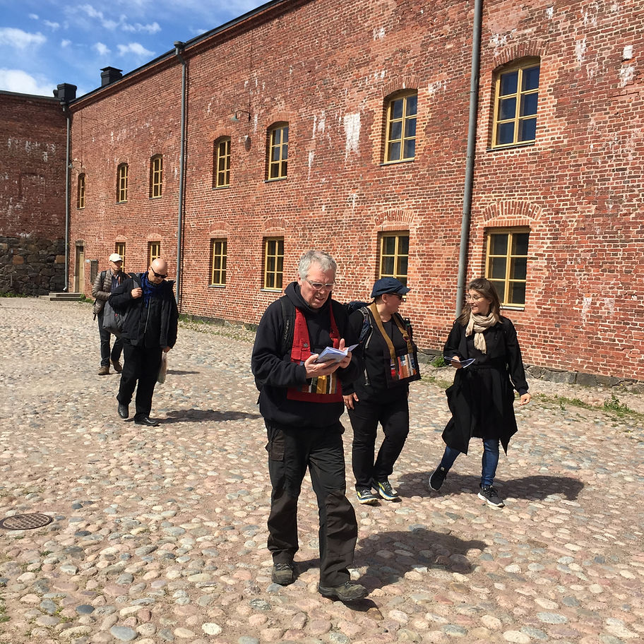 Roshi Frank visiting Suomenlinna fortress island. One of the civil war prisons on the background